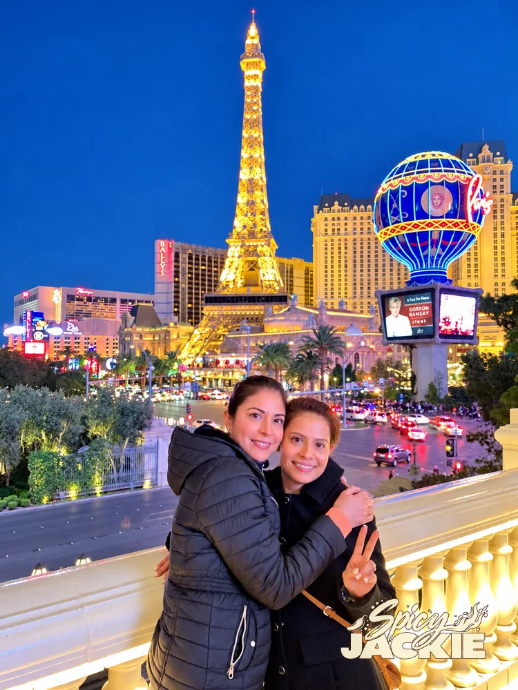 Jackie and a companion embracing with the Las Vegas lights behind them
